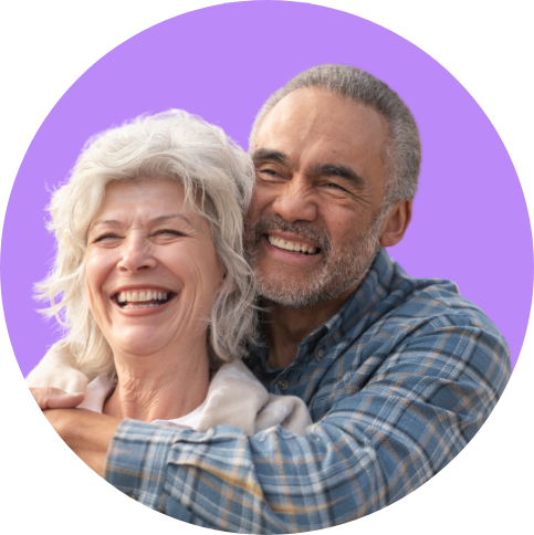 Happy older couple hugging and smiling together.